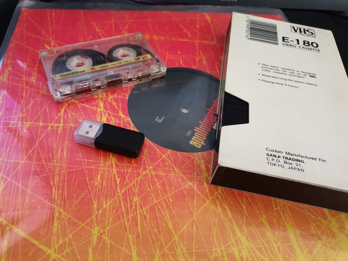 A VHS cassette, Video 8 tape and USB capture device on the Galvitech Paarl workbench